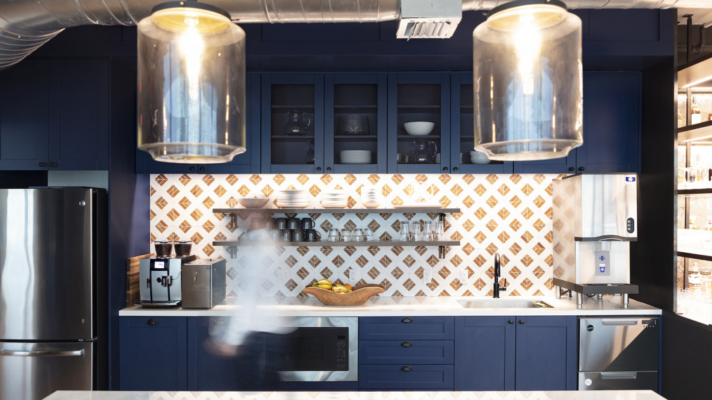 A kitchen with a large light.